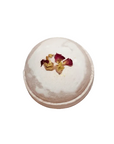 Round white trinket box with floral design on a white background
