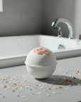   on a white surface with a bathtub in the background